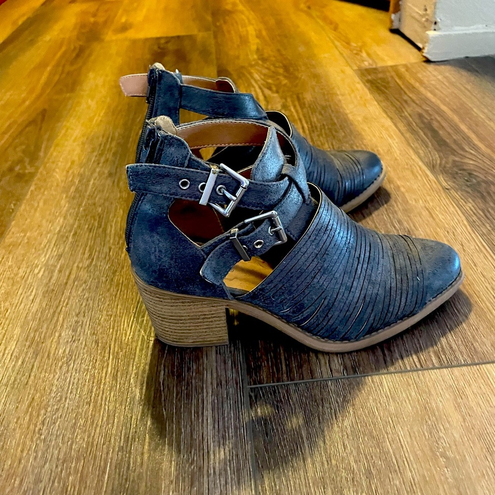 Woman’s gray dressy boots.